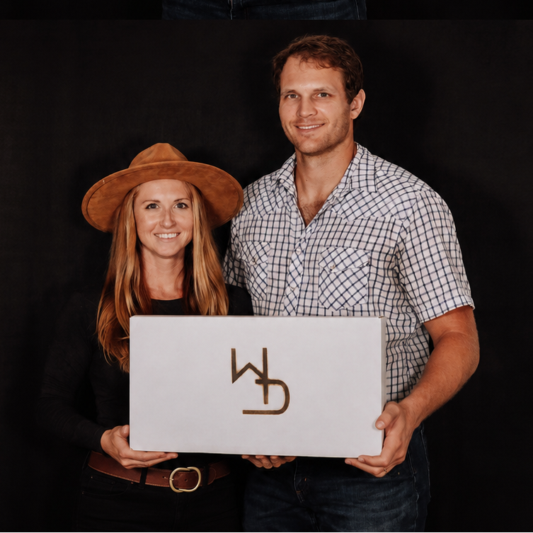 A split-screen lifestyle photo showing a man and a woman holding a white rectangular box with a brown 'W&D' logo, set against a black studio backdrop.