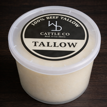 Container of tallow with a label on a dark wooden surface